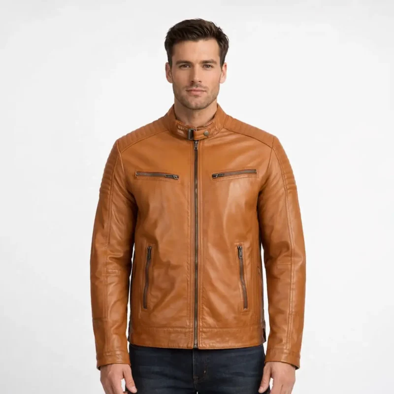 Front view of men's cognac brown leather motorcycle jacket with stand collar, central zip closure, quilted shoulder panels, chest and waist zipper pockets