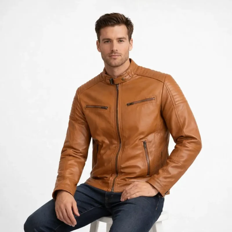 Men's Cognac Leather Jacket Seated Position - Comfort and Mobility Design Man seated wearing tan brown leather biker jacket showing range of motion, waist pocket accessibility, and comfortable fit while sitting