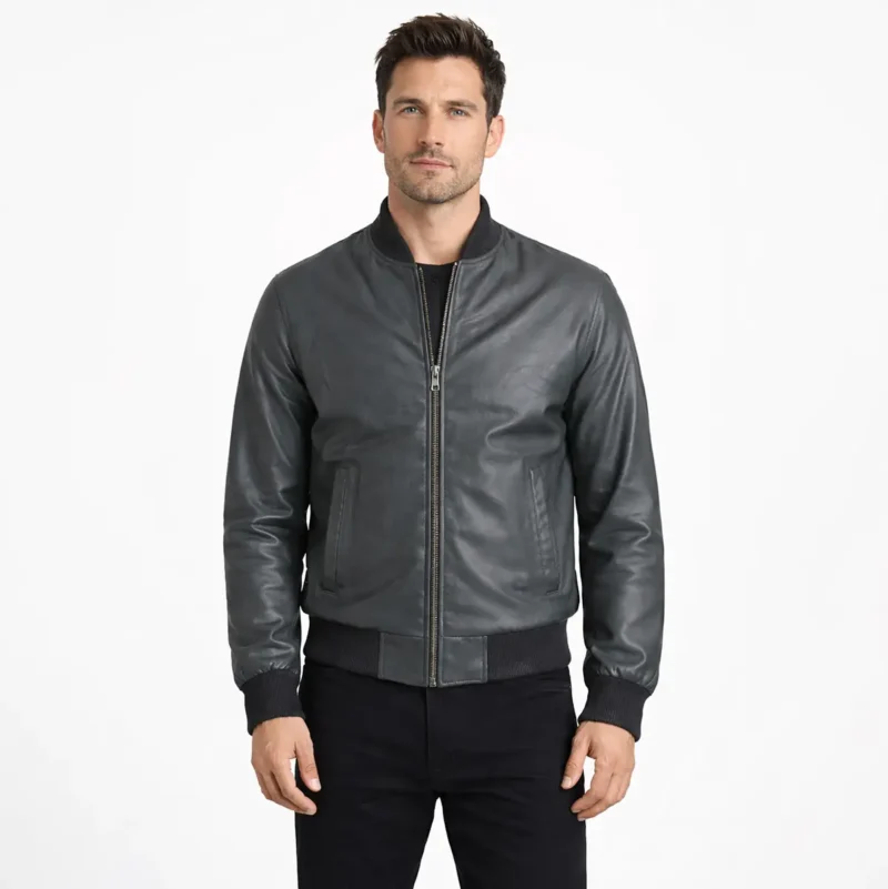 Man wearing gray leather bomber jacket with ribbed collar cuffs and hem front zipper closure on white background