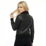 Rear view of Astra Prime black leather bomber jacket showing smooth back panel, ribbed knit waistband and cuffs, and classic bomber silhouette