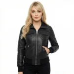 Woman wearing Astra Prime black leather bomber jacket with shirt collar, center zip closure, dual chest flap pockets, ribbed knit cuffs and hem, and all-black outfit on white background