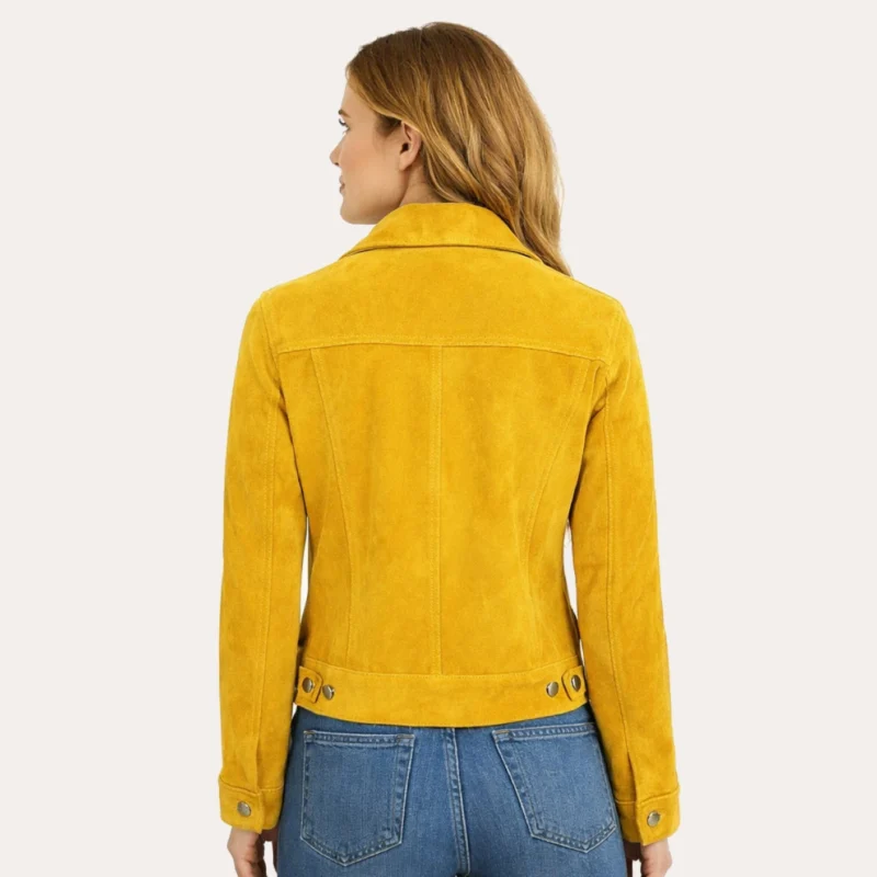 Woman wearing mustard yellow suede trucker jacket, demonstrating comfortable fit and soft suede texture