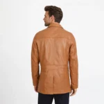 Rear view of tan cognac leather jacket showing smooth back panel, center pleat detailing, and hip-length cut - Aurelius Heritage Leather Blazer
