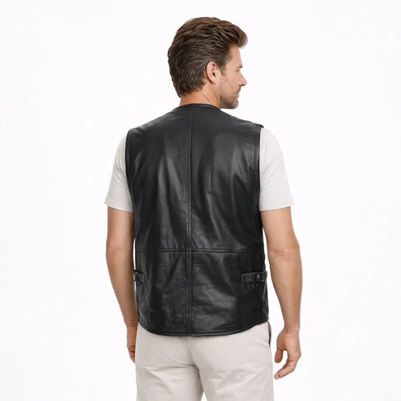 Back profile of black leather utility vest showing multiple cargo pockets, structured fit, V-neck, and sleeveless tactical design of Blackforge Sentinel Leather Riding Vest