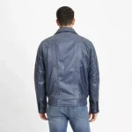 Back profile of navy blue distressed leather bomber jacket showing relaxed fit, stand collar, elasticized waist, and classic bomber silhouette