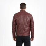 Rear view of burgundy wine-colored leather cafe racer jacket showing raglan sleeve seams, center back panel, straight hem with side adjusters, and rich oxblood finish