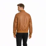 Rear view of tan cognac leather bomber jacket showing clean back panel, ribbed knit hem, smooth leather finish, center back construction, and timeless flight jacket proportions