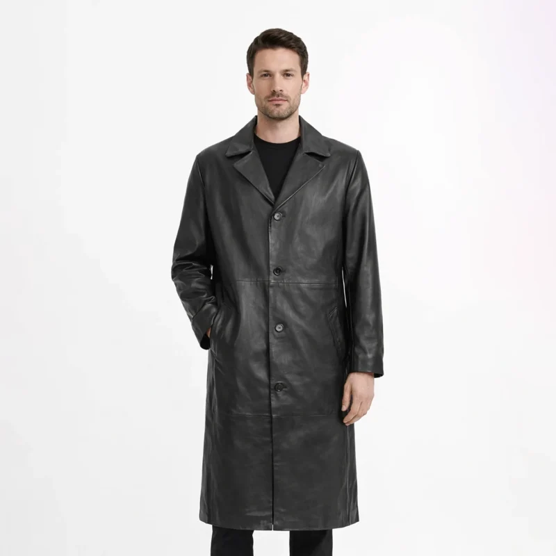 Front view of men's black leather trench coat with notched lapels, button-front closure, horizontal seam at waist, slash hand pockets, knee-length cut