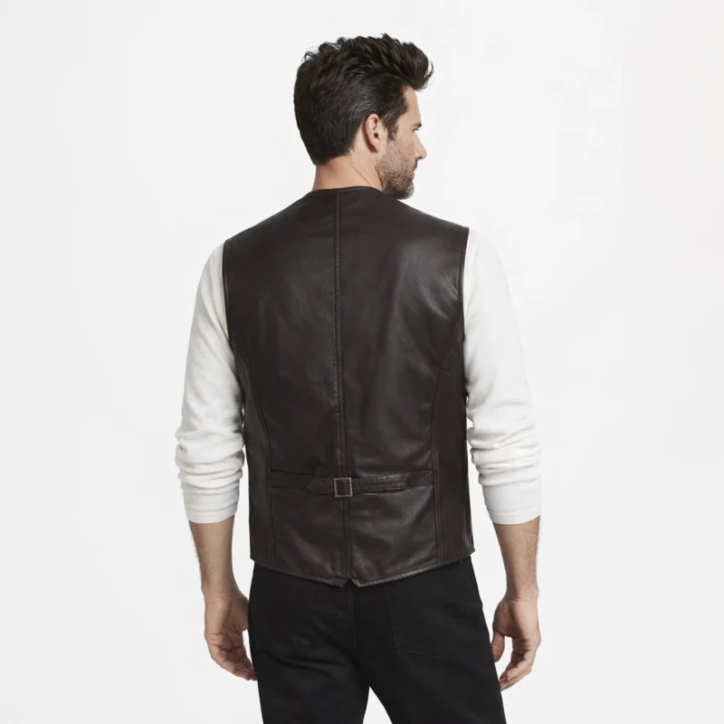 Man wearing dark brown leather vest layered over white long-sleeve shirt and black pants for smart-casual look of Classic Snap Biker Waistcoat
