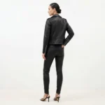 Back view of women’s black studded leather fashion jacket showing smooth leather finish