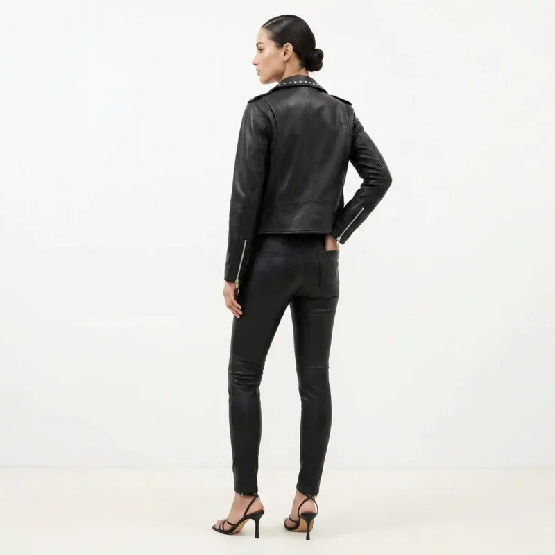Back view of women’s black studded leather fashion jacket showing smooth leather finish