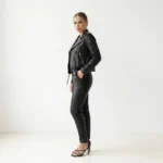 Side view of women’s black studded leather jacket showing slim fit and zip details