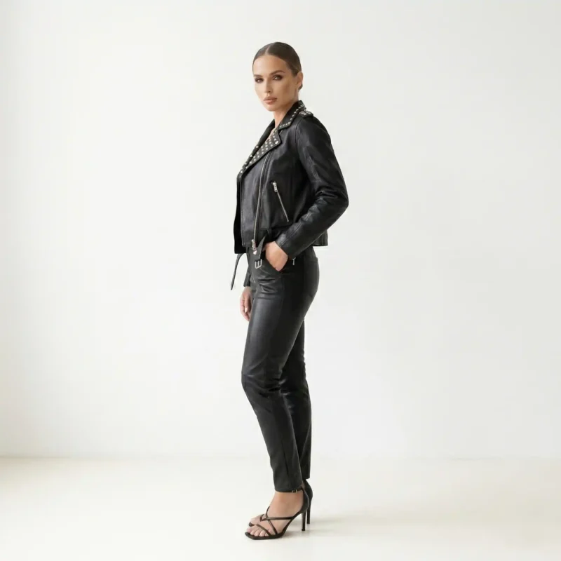 Side view of women’s black studded leather jacket showing slim fit and zip details