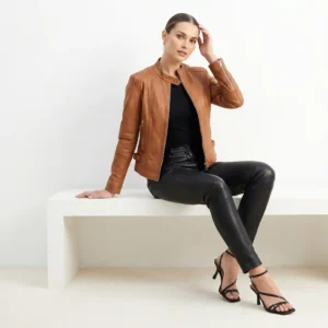 Front view of women’s tan leather rider jacket with zip-front and slim fit