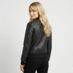 Rear view of Eclipse black leather bomber jacket showing diamond quilted back panel, smooth leather sleeves, ribbed waistband, and bomber silhouette
