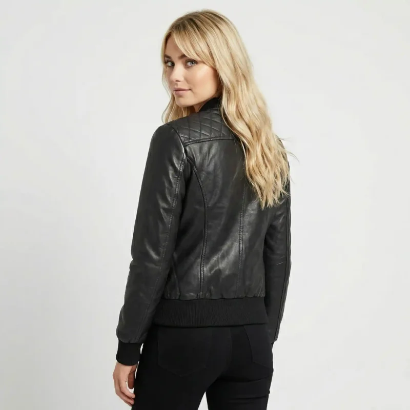 Rear view of Eclipse black leather bomber jacket showing diamond quilted back panel, smooth leather sleeves, ribbed waistband, and bomber silhouette