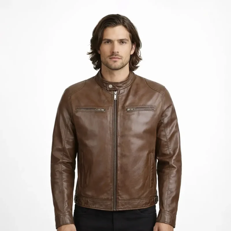 Front view of men's brown leather motorcycle jacket with band collar, snap button closure, central zipper, horizontal chest zip pockets, raglan sleeves, and vintage distressed finish