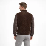 Rear view of brown suede bomber jacket showing diamond quilted suede back panel, quilted leather sleeves, and ribbed knit hem band