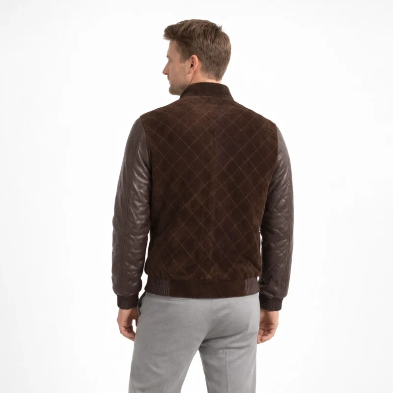 Rear view of brown suede bomber jacket showing diamond quilted suede back panel, quilted leather sleeves, and ribbed knit hem band