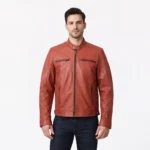 Front view of men's burnt orange terracotta leather motorcycle jacket with band collar, snap button closure, central zipper, horizontal chest zip pockets, diagonal waist pockets, and contemporary moto styling