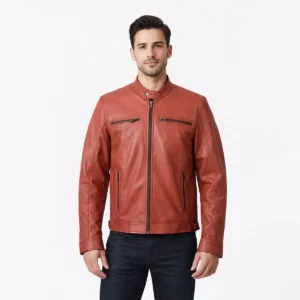 Front view of men's burnt orange terracotta leather motorcycle jacket with band collar, snap button closure, central zipper, horizontal chest zip pockets, diagonal waist pockets, and contemporary moto styling