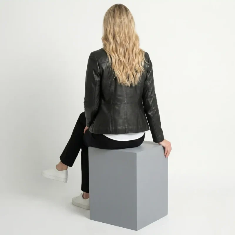 Back view of women’s black leather blazer showing structured tailoring, smooth leather finish, and clean back design