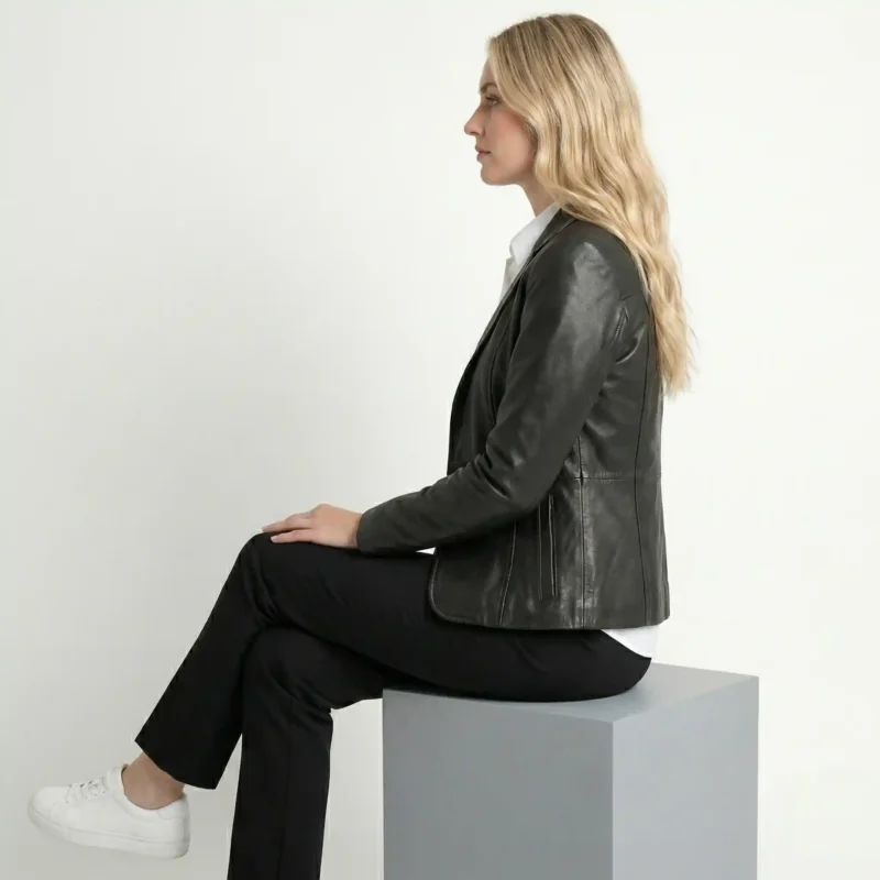 Side view of women’s black tailored leather blazer showing contoured fit and structured blazer cut of Luxe Sovereign Leather Blazer