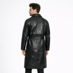 Rear view of black leather trench coat showing clean back panel, center vent, knee-length proportion, belted waist detail - Midnight Dominion Premium Leather Trench Coat