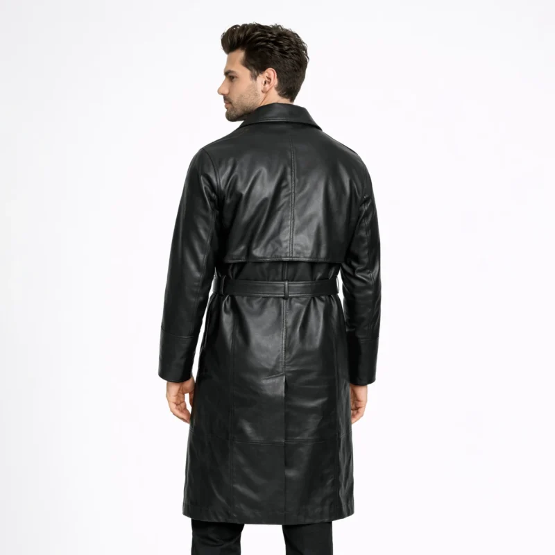 Rear view of black leather trench coat showing clean back panel, center vent, knee-length proportion, belted waist detail - Midnight Dominion Premium Leather Trench Coat