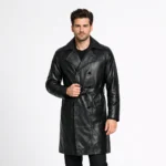 Front view of men's black leather trench coat with wide notched lapels, double-breasted button closure, belted waist, slash pockets, knee-length cut