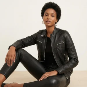 Women's black leather moto jacket with band collar, asymmetric zipper closure, chest and waist zipper pockets, and fitted silhouette - front view