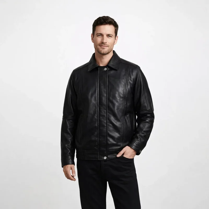 Front view of men's black leather bomber jacket with shirt collar, snap button closure, vertical topstitching detail, diagonal hand pockets, ribbed cuffs and hem, and relaxed aviator fit
