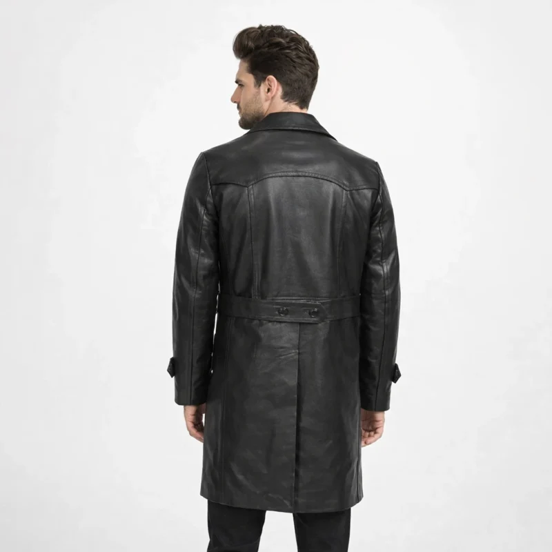 Rear view of black leather peacoat showing smooth back panel, tailored waist, mid-thigh length, and structured shoulders