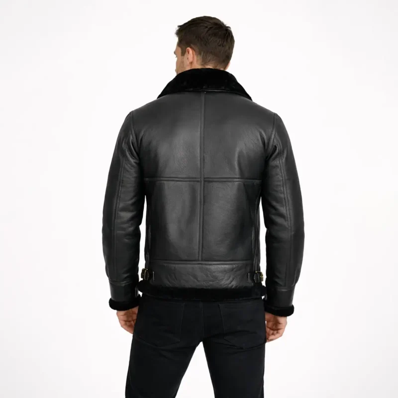 Back view of black leather shearling jacket showing center back seam fur collar and bomber jacket construction