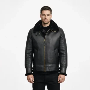 Man wearing black leather shearling jacket with fur collar and gold zipper front on white background - Midnight Sovereign Shearling Jacket
