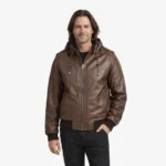 Men's brown leather bomber jacket with removable hood, shoulder epaulettes, front zipper closure, and ribbed cuffs and waistband - front view