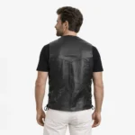 Rear view of black leather motorcycle vest showing clean back panel, side lace adjusters, sleeveless construction, classic biker vest design - Nocturne Atlas Leather Tactical Vest