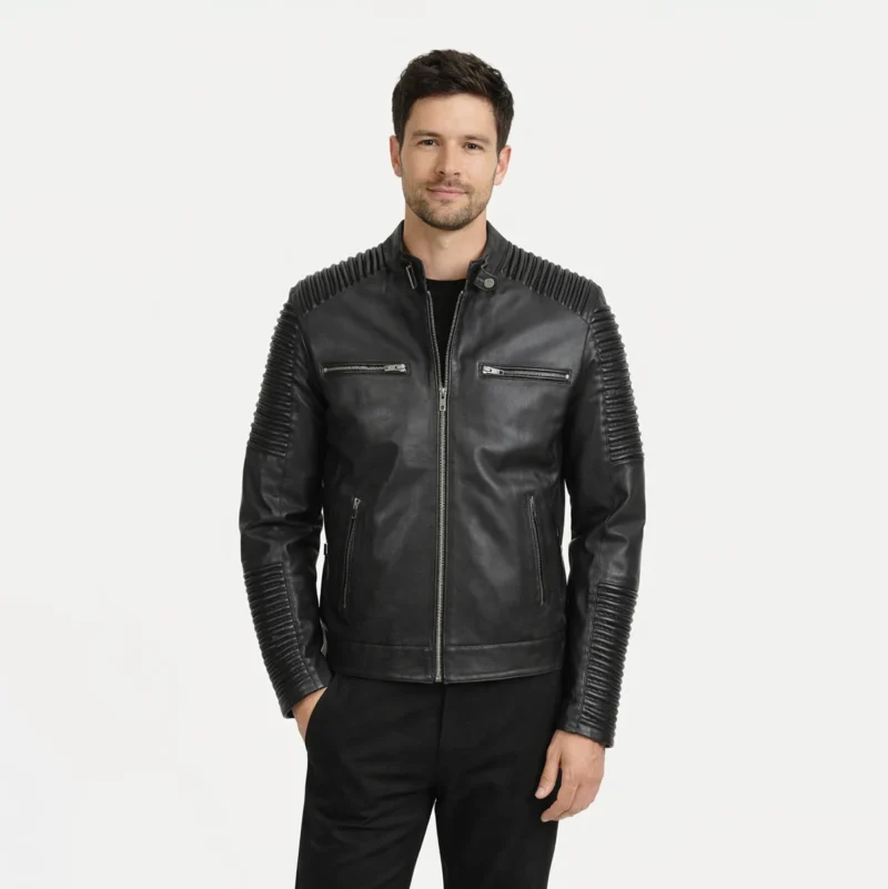 Front view of men's black leather motorcycle jacket with stand collar, quilted ribbed shoulders and sleeves, snap button collar closure, central zipper, horizontal chest zip pockets, diagonal waist pockets, and modern biker styling