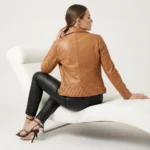 Side profile of tan cognac leather moto jacket showing wide lapels, asymmetric zipper, fitted waist, and sleek silhouette - Noir Prestige Slim-Fit Leather Jacket