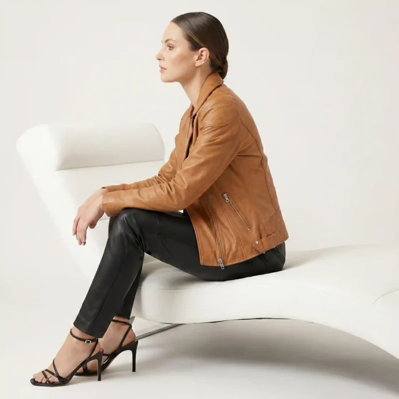 Side profile of tan cognac leather moto jacket showing wide lapels, asymmetric zipper, fitted waist, and sleek silhouette - Noir Prestige Slim-Fit Leather Jacket