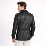 Back profile of black leather peacoat showing notched lapels, structured shoulders, medium length, and classic peacoat silhouette - Noir Sovereign Leather Blazer