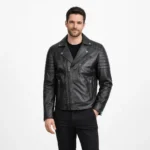 Man wearing black leather motorcycle jacket with asymmetric zipper closure, quilted shoulder panels, and silver hardware on light gray background