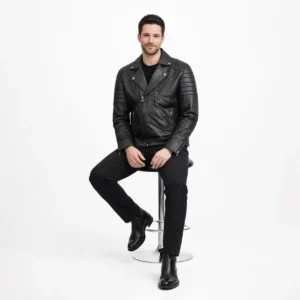 Man seated wearing black leather motorcycle jacket showing comfort, flexibility, and maintained structure while sitting