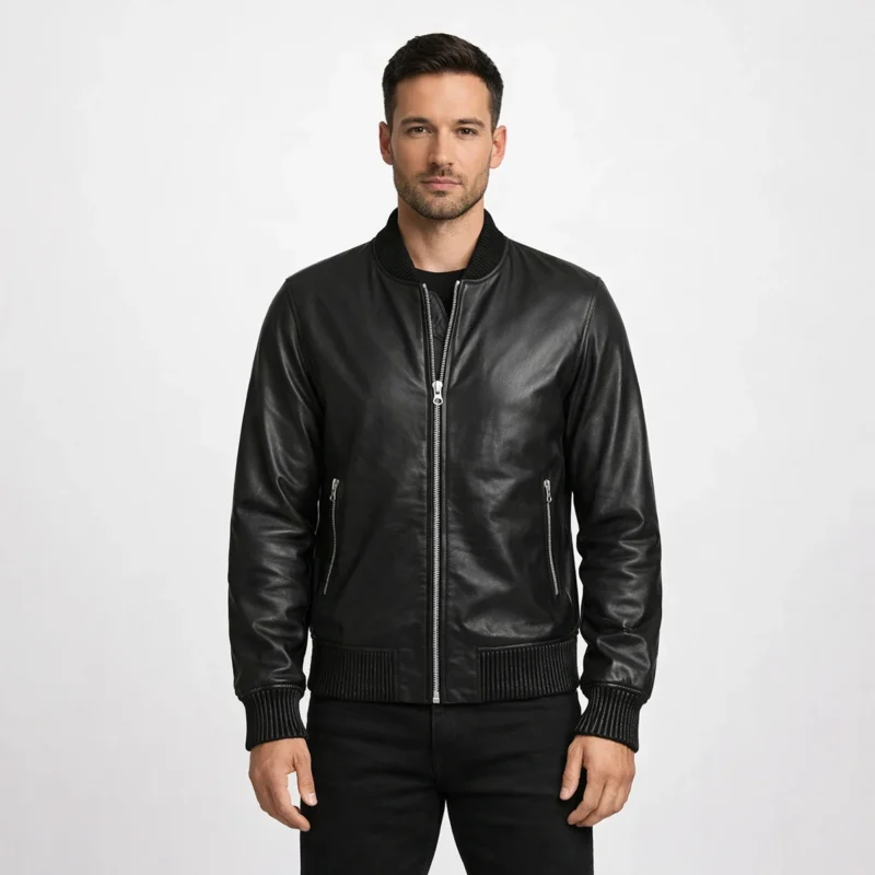 Men's sleek black leather bomber jacket with ribbed collar, front zipper closure, side zipper pockets, and ribbed cuffs and waistband - front view