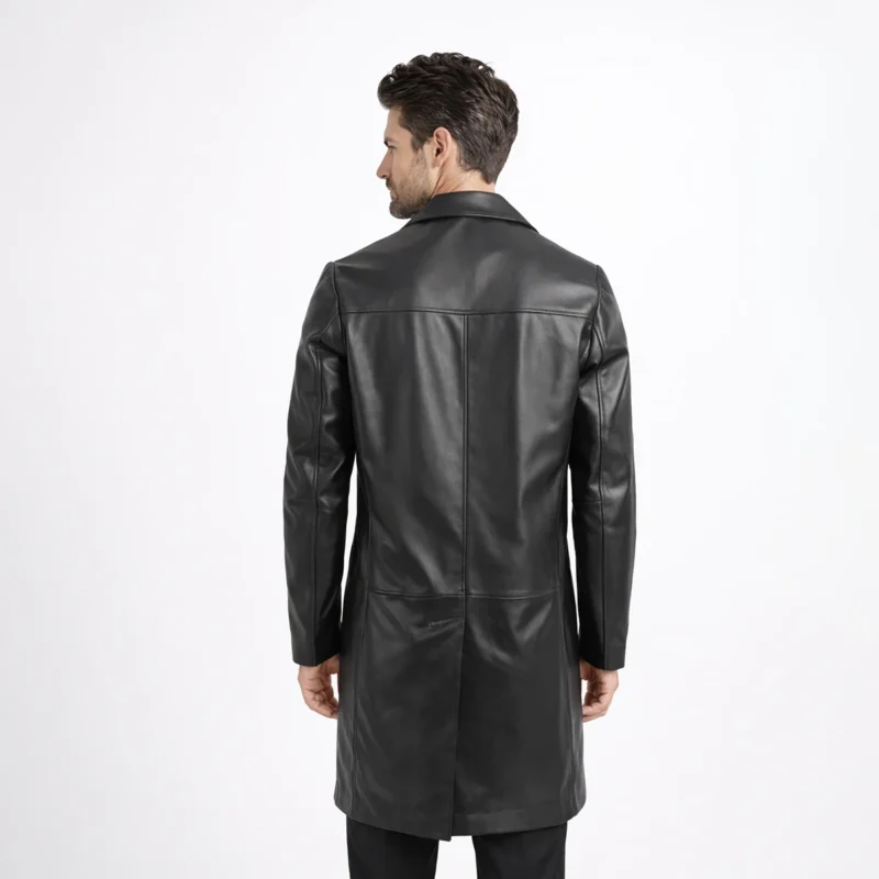 Back view of black leather car coat showing center back seam vertical stitching and mid thigh length hem - Obsidian Regent Leather Coat