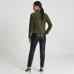 Rear view of olive green suede motorcycle jacket showing smooth back panel, fitted waist, structured shoulders, and hip-length cut