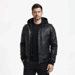 Front view of men's black leather jacket with detachable black hood, asymmetric zipper chest pocket, central zipper, shoulder straps, ribbed cuffs and hem