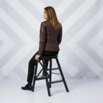 Rear view of brown leather moto jacket - Rustic Charm Leather Rider Jacket - showing fitted back panel, waist belt detail, feminine tailored construction, classic biker design