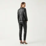 Rear view of Shadow Muse black leather jacket showing smooth back panel, princess seams, fitted waist, and hip-length cut - Shadow Muse Jacket