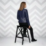 Side profile of navy blue leather blazer showing fitted silhouette, stand collar, hip-length cut, and sleek tailored construction - Signature Sculpted Navy Leather Jacket